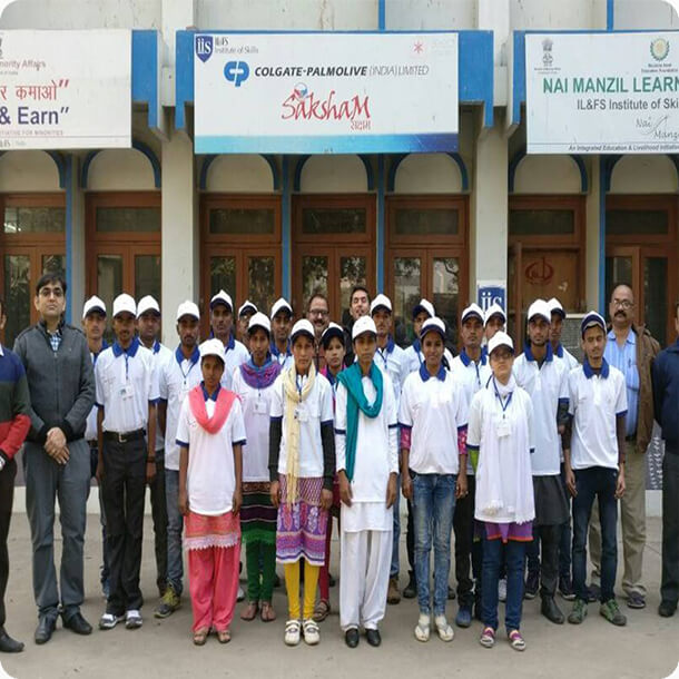 Group of trainees standing outside the IL&FS Institute of Skills under the Colgate-Palmolive Saksham and Nai Manzil learning initiatives.